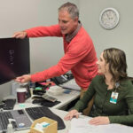Jared Erie is pictured with staff at Connect Medical while providing an ergonomic assessment.